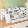 A white bed with integrated shelving, a desk, and LED lighting, set against a green and yellow wall. Náhľad obrázku produktu