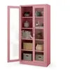 A pink metal cabinet with glass doors and shelves, displaying various decorative items and storage boxes. Produktbild-Vorschau