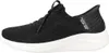 A side view of a black Skechers slip-on sneaker with a white sole. Produktbild-Vorschau
