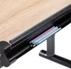 A close-up view of a desk with a ruler and colored pencils in a tray. Produktbild-Vorschau