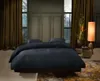 A bedroom scene with a bed, curtains, and a lamp. Produktbild-Vorschau