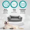 A dog bed is shown with a dog lying in front of it, and marketing icons and text above. Podgląd zdjęcia produktu