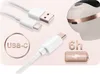 A marketing image showing a white electric breast pump with rose gold accents, along with USB-C charging cables and battery life indicator. Produktbild-Vorschau