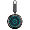 The bottom of a frying pan is shown against a white background. Voir les images du produit