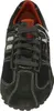 A top-down view of a dark gray sneaker with off-white accents and orange trim inside. Produktbild-Vorschau