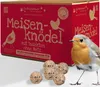 A box of bird food with a robin in the foreground.