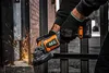 A person is using an angle grinder to cut metal bars, creating sparks. Voir les images du produit