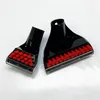 Two black cleaning attachments with red bristles are shown on a white background. Voir les images du produit