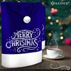 A Christmas-themed chair cover with a cup of steaming coffee in the foreground, set against a blurred Christmas tree background. Produktbild-Vorschau