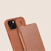 A close-up shot of a brown leather phone case with a sliding camera cover. Podgląd zdjęcia produktu