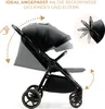A black stroller is shown from the side with arrows indicating adjustable features. Podgląd zdjęcia produktu