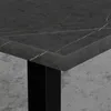 Close-up of a dark marble tabletop with white veining, supported by a black leg. Produktbild-Vorschau