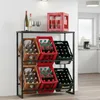 A multi-tiered metal rack holding several crates of bottled drinks in a domestic setting. Produktbild-Vorschau