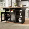 A kitchen island cart with a wooden countertop and black cabinets, featuring a microwave, toaster, and various kitchen items. Produktbild-Vorschau