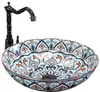 A decorative washbasin with a faucet, presented on a white background. Náhled obrázku produktu