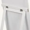A close-up view of the hinges and support structure on the back of a white stand mirror. Náhľad obrázku produktu