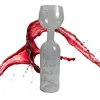 A unique wine glass shaped like a bottle, with red wine splashing around it. Náhľad obrázku produktu
