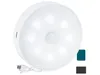 A white, circular LED light with a motion sensor in the center, shown against a white background. A USB charging cable is visible in the lower left corner. Two colored squares, teal and black, are present on the right side. Produktbild-Vorschau
