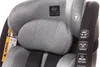 Close-up of a gray car seat with safety labels. Produktbild-Vorschau