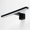 A black LED light fixture mounted on a white wall. Náhľad obrázku produktu