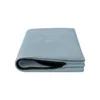 A folded blue cushion cover with a black zipper is shown against a white background. Produktbild-Vorschau