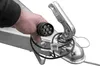A hand holding a trailer connector plug near a trailer hitch. Produktbild-Vorschau