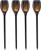 Four black solar garden lights with flame-like LED lights, arranged in a row against a white background. Produktbild-Vorschau
