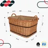 A wicker basket with dimensions indicated by measurement lines and text. Voir les images du produit