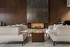 A modern living room with a fireplace and seating area. Produktbild-Vorschau