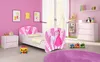 A child's bedroom with a bed, dresser, and toys. Produktbild-Vorschau