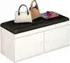 A white shoe cabinet with a black padded top, decorated with two handbags and a stack of books. Anteprima dell’immagine prodotto