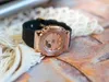 A close-up shot of a rose gold Casio G-Shock watch with a black band, resting on a textured surface and a white knitted fabric. Produktbild-Vorschau