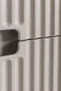 A close-up view of a beige cabinet with a ribbed texture and a gap between two sections. Náhľad obrázku produktu
