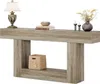 A console table with decorative items on top and a basket on the shelf. Anteprima dell’immagine prodotto