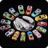 A collection of colorful toy cars arranged in a circular pattern on a black background, with a close-up of metal rods in the center. Náhľad obrázku produktu