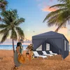 People on a beach with a gazebo and lounge chairs. Náhled obrázku produktu