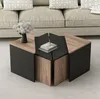 A set of modular coffee tables arranged in a living room setting in front of a sofa. Produktbild-Vorschau