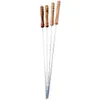 Four metal skewers with wooden handles are arranged diagonally against a white background. Produktbild-Vorschau