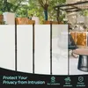 An outdoor patio scene with a privacy screen. Produktbild-Vorschau