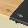 Close-up of a bamboo and black metal shelf, showing its extendable feature with arrows. Produktbild-Vorschau