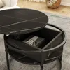 A close-up view of a black marble-patterned coffee table with its top lifted, revealing storage space inside. Anteprima dell’immagine prodotto