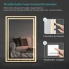 A mirror with LED lighting is shown in a living room setting, with instructions on how to use a wall switch to control it. Produktbild-Vorschau