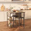 A kitchen scene with a bar table and stools, along with kitchen appliances and decor. Náhľad obrázku produktu