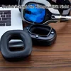 A close-up shot of replacement ear pads and a headset, with a laptop in the background. Produktbild-Vorschau