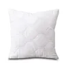 A white quilted pillow is shown against a white background. Produktbild-Vorschau