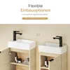 Two identical bathroom vanity units with sinks and faucets are shown side-by-side, with one unit's cabinet door open to reveal storage shelves. The image is set against a plain, light-colored wall. Náhled obrázku produktu