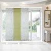 Panel curtains hanging in front of a sliding glass door overlooking a backyard. Náhled obrázku produktu