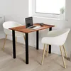 A small wooden table with two white chairs, a laptop, and a coffee cup, set up in a bright room near a window. Náhľad obrázku produktu