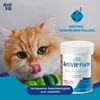 A cat is licking its lips next to a product container. Náhľad obrázku produktu