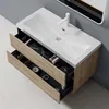 A bathroom vanity with an open drawer displaying various toiletries and accessories. Anteprima dell’immagine prodotto